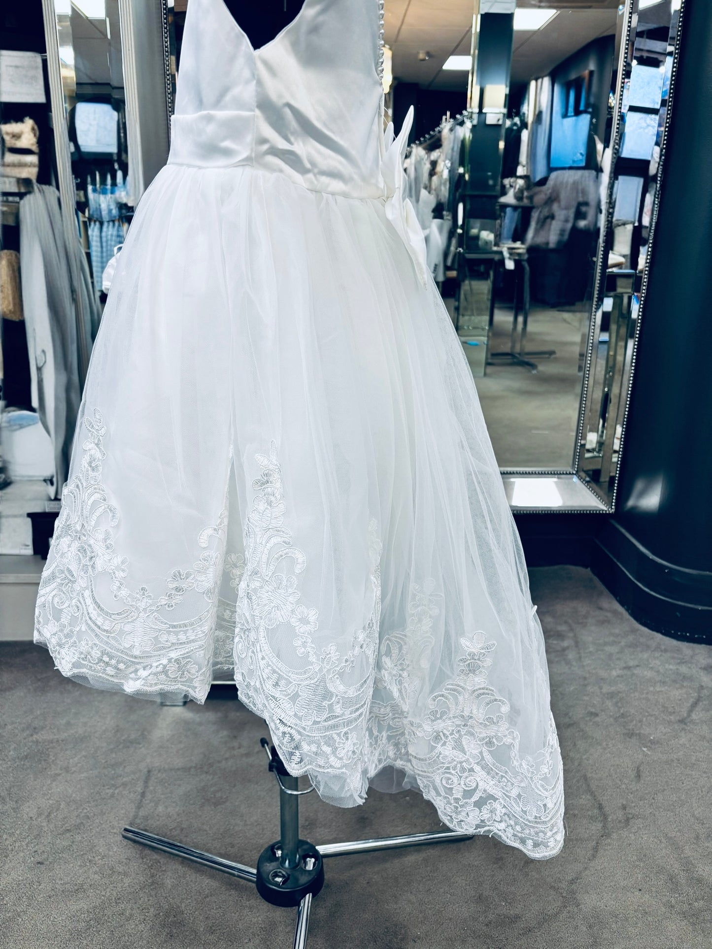 A knee length delight communion dress