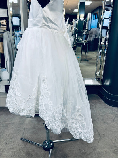 A knee length delight communion dress